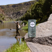 Black Spruce Paperboard Deodorant with man fishing in background