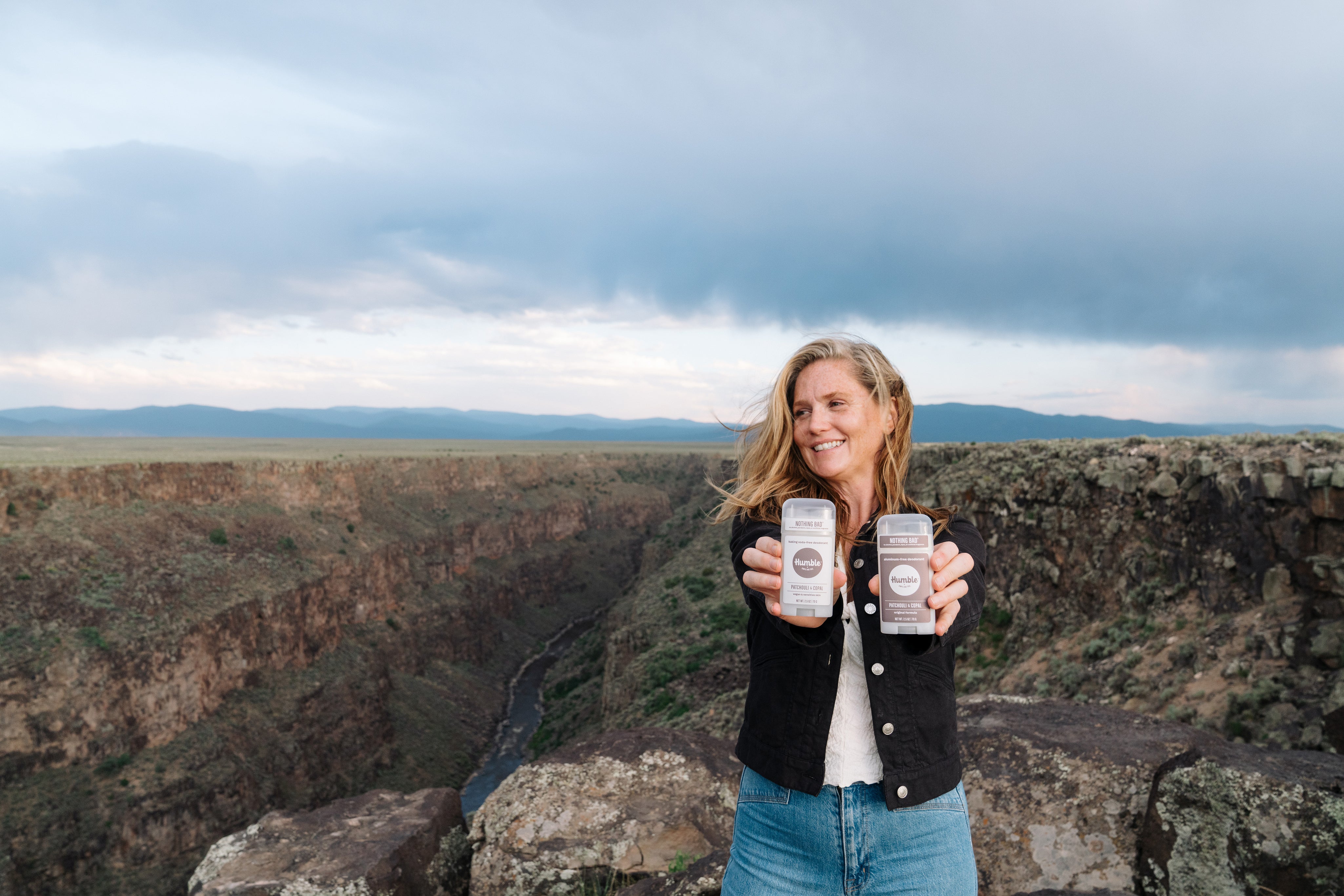 Woman holding Patchouli and Copal Deodorants