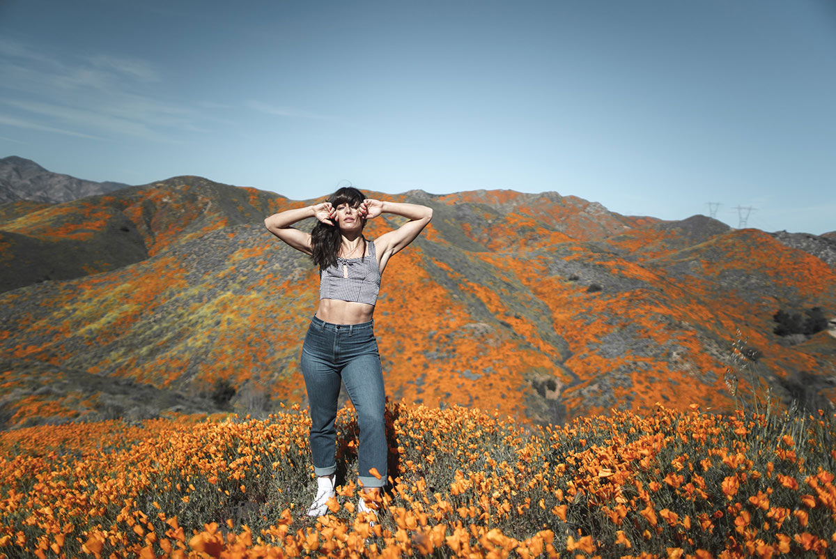 Woman in a field of poppies