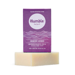Front view of Mountain Lavender bar soap box and soap showcasing shea butter and olive oil on white background