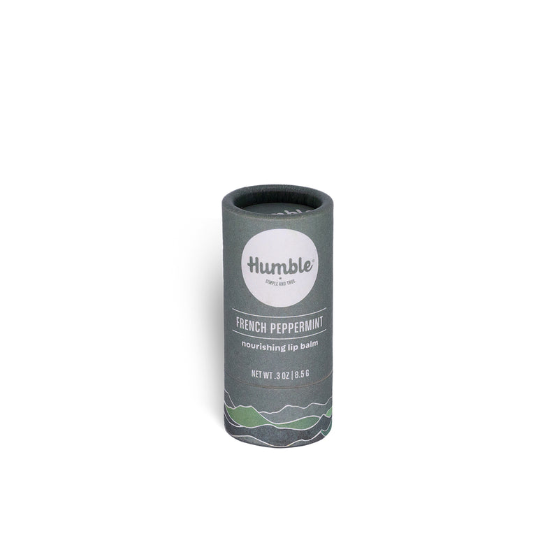Lip balm container with 'Humble' branding on a white background
