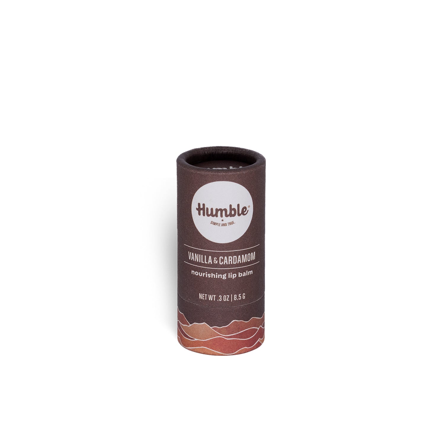 Front view of Vanilla & Cardamom plastic-free lip balm tube showing Humble logo and cardboard tube on white background