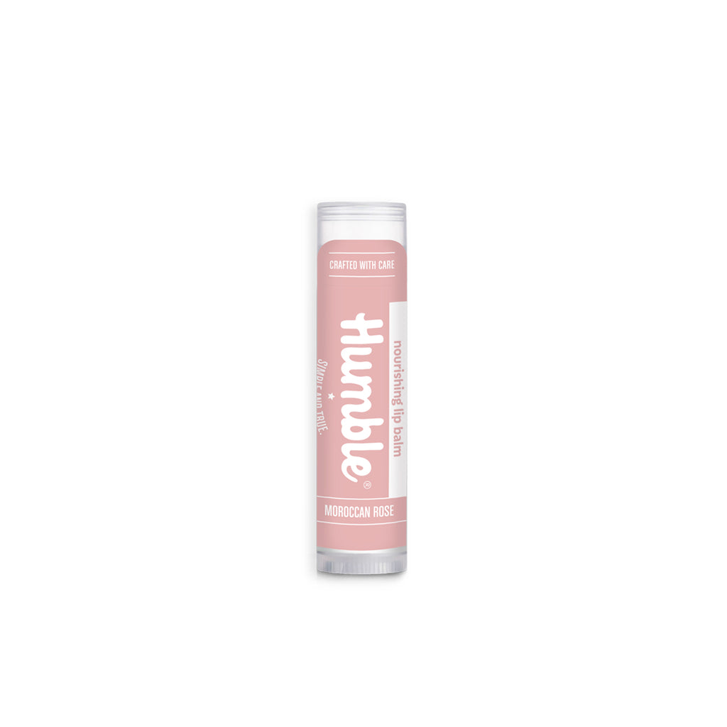 Front view of Moroccan Rose lip balm tube showcasing pink label with Humble logo and clear cap on white background