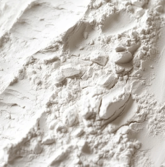 Close-up of white powder with small stones on a textured surface