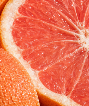 Close-up of a sliced grapefruit showing juicy interior.