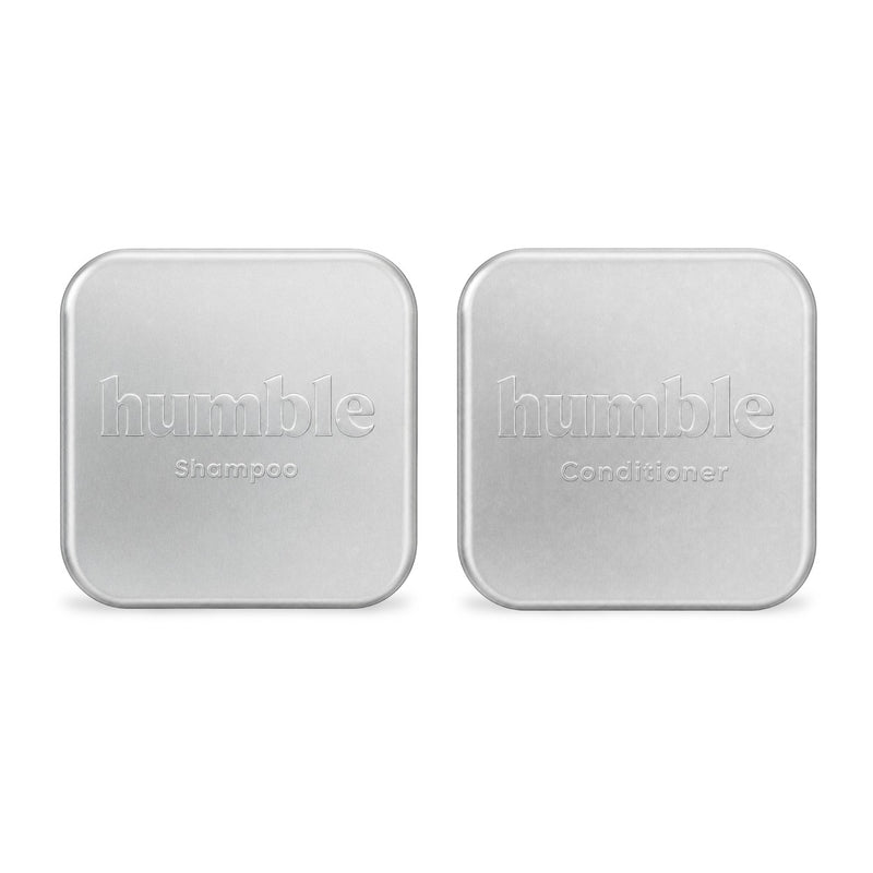 Humble Travel Tins, closed, anodized aluminum lids — humble Shampoo stamped into one, humble Conditioner into the other