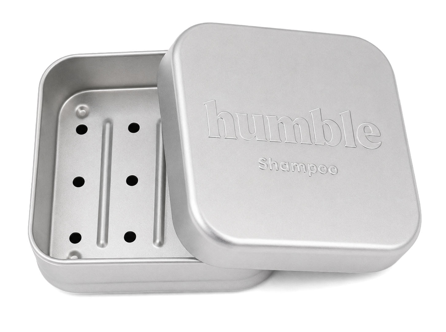 Humble Travel Tin for shampoo bars, open, showing the removable draining tray with six holes and two raised ribs