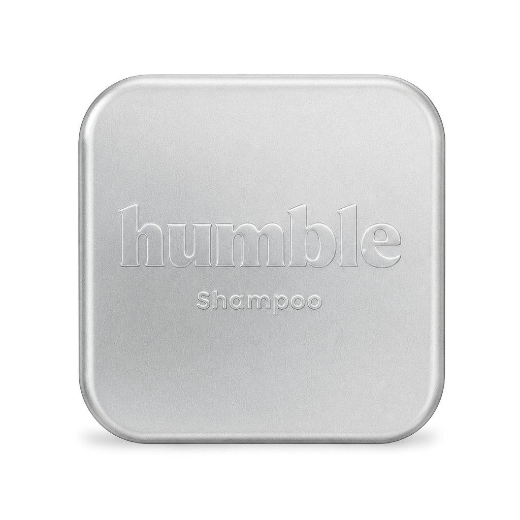 Humble Travel Tin, closed, anodized aluminum lid with the humble wordmark and Shampoo stamped into the metal