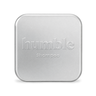 Front view of Humble Shampoo tin showcasing its silver metal case on a white background