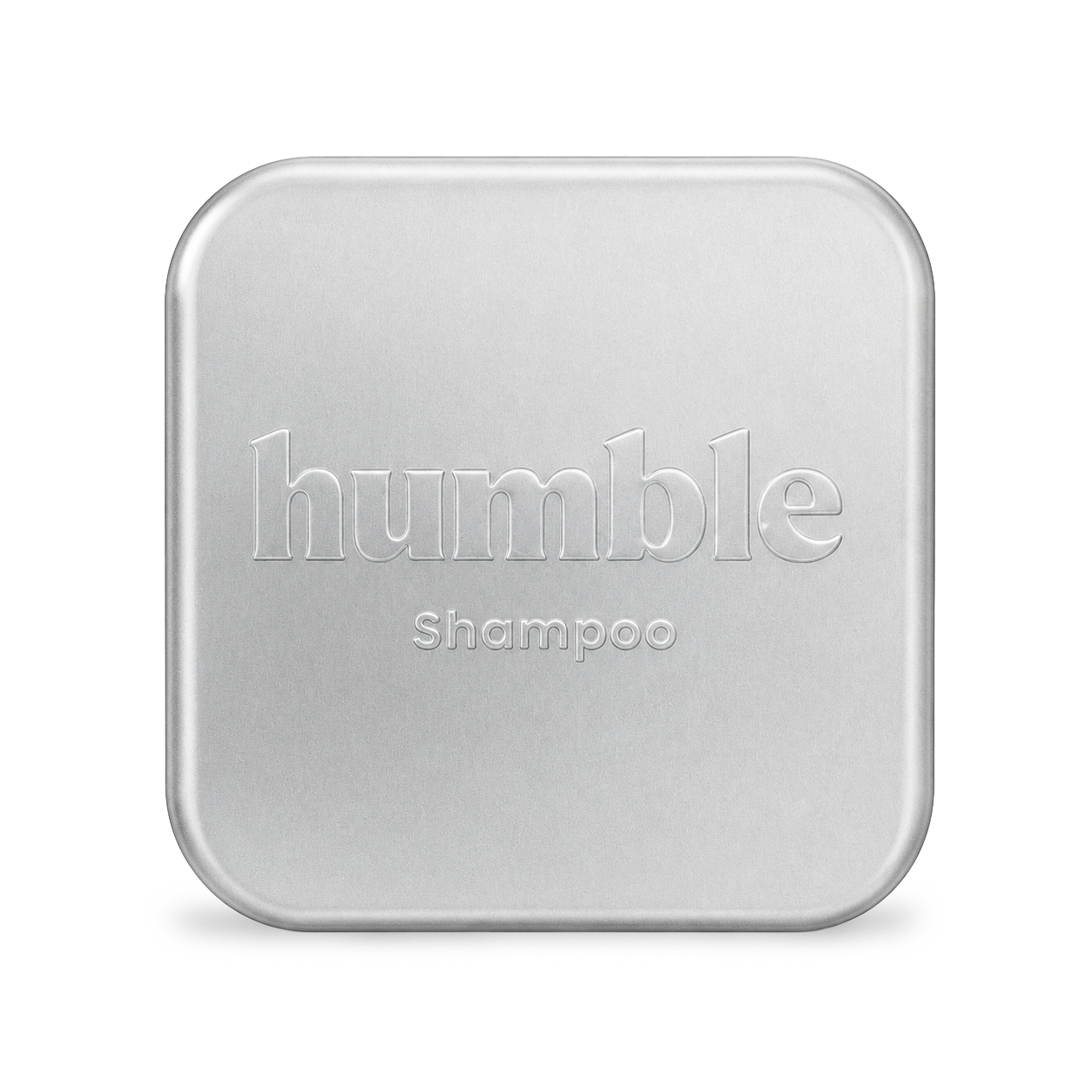 Humble Travel Tin, closed, anodized aluminum lid with the humble wordmark and Shampoo stamped into the metal