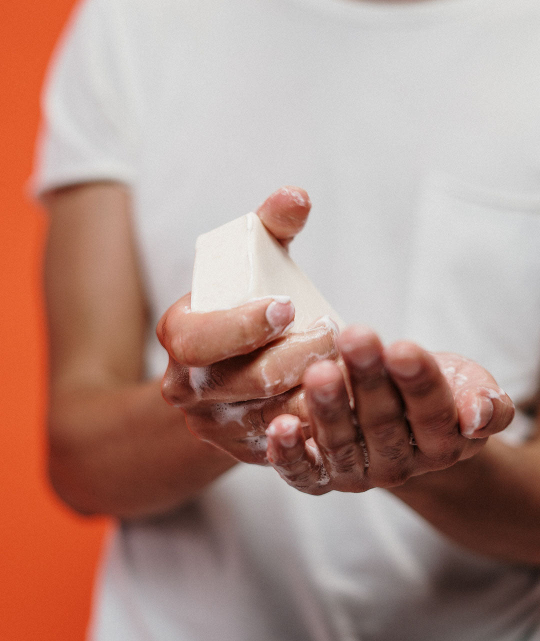 bar soap being used to wash hands 