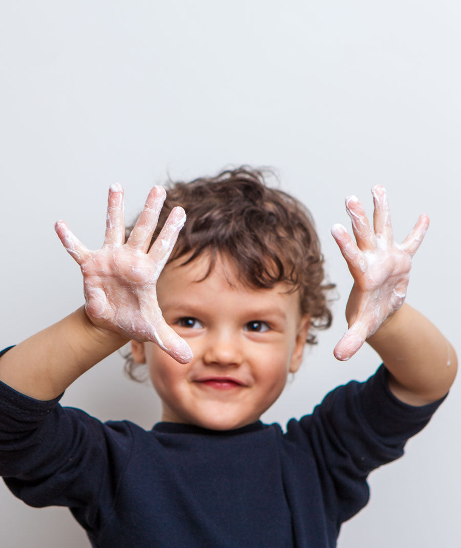 child washing hands